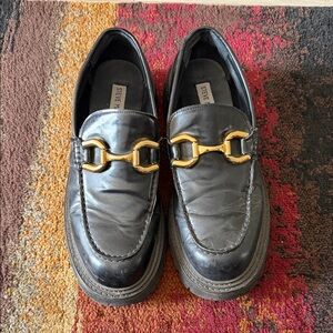 Steve Madden Black Slip-Ons with Gold Detail
